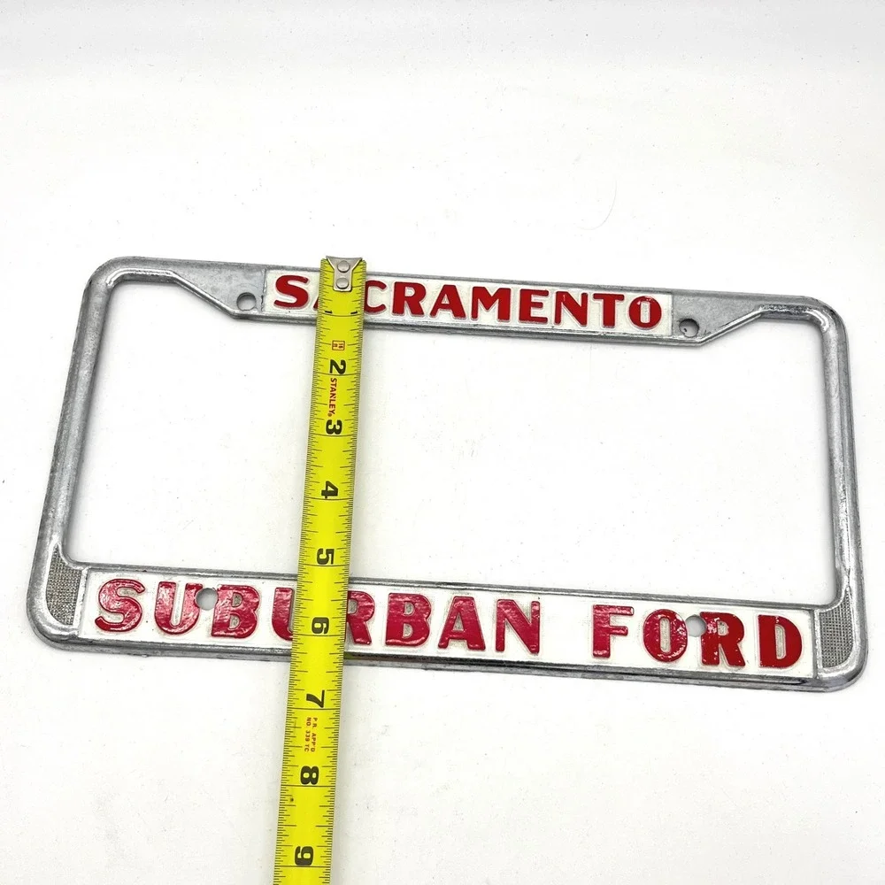 Vintage Suburban Ford Sacramento License Plate Frame Chrome Red White Metal